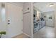 Entryway view of a kitchen featuring gray cabinetry, stainless steel appliances, and wood-look tile flooring at 8701 Gainsford Ct, Charlotte, NC 28210