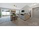 Cozy living room features a fireplace, vaulted ceilings, and lots of natural light at 8701 Gainsford Ct, Charlotte, NC 28210