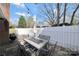 Outdoor patio with a dining table and string lights, perfect for entertaining or relaxation at 8701 Gainsford Ct, Charlotte, NC 28210