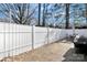 Private fenced patio with room for a grill and an outdoor dining set, perfect for entertaining at 8701 Gainsford Ct, Charlotte, NC 28210