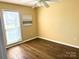 Bedroom featuring a ceiling fan, wood-look flooring, and a window at 8723 Totteridge Dr, Charlotte, NC 28277