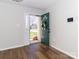 Bright foyer featuring wood floors, a decorative wreath and natural light at 8723 Totteridge Dr, Charlotte, NC 28277