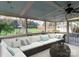 Relaxing screened porch with comfortable seating and a view of the backyard at 8723 Totteridge Dr, Charlotte, NC 28277