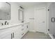 Modern bathroom with double sinks, granite countertops, and a glass-enclosed shower creating a luxurious space at 110 Walters St, Huntersville, NC 28078