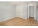 Bright bedroom with closet and wood-look floors ready for furnishings at 110 Walters St, Huntersville, NC 28078