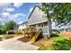 Side view of a new home featuring a backyard and wooden deck at 110 Walters St, Huntersville, NC 28078