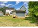 Back of a new home showing backyard, deck, and new construction at 110 Walters St, Huntersville, NC 28078