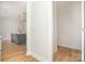 Hallway view showcasing the modern kitchen and its stylish pendant lighting at 110 Walters St, Huntersville, NC 28078