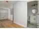 Hallway leads to a bathroom featuring a modern vanity and stylish fixtures at 110 Walters St, Huntersville, NC 28078