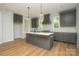 Beautiful kitchen featuring stainless steel appliances, stylish pendant lighting, and a functional center island at 110 Walters St, Huntersville, NC 28078