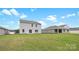 The large grassy backyard provides ample space for a home flanked by other properties at 1113 Foxberry Ln, Maiden, NC 28650