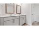 Bright bathroom with double sinks, quartz countertops, and wooden-framed mirrors at 1113 Foxberry Ln, Maiden, NC 28650