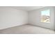 Bedroom features neutral carpet, natural light, and a window with neighborhood views at 1113 Foxberry Ln, Maiden, NC 28650