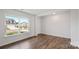Bedroom featuring hardwood floors and a large window overlooking the front yard at 1113 Foxberry Ln, Maiden, NC 28650