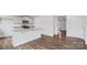 Bright kitchen features granite countertops and stainless steel microwave at 1113 Foxberry Ln, Maiden, NC 28650