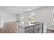 Open concept kitchen featuring an island with a sink and seating area at 1113 Foxberry Ln, Maiden, NC 28650