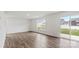 Spacious living room with hardwood floors and sliding glass door to backyard at 1113 Foxberry Ln, Maiden, NC 28650