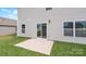 A concrete patio sits just off the side of the house, with a sliding door entrance to the home at 1113 Foxberry Ln, Maiden, NC 28650