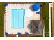 Aerial view of the community pool, pool house, blue umbrellas and lounge chairs at 1117 Foxberry Ln, Maiden, NC 28650