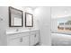 Bathroom featuring dual sinks, framed mirrors, white cabinets and tile floor at 1117 Foxberry Ln, Maiden, NC 28650