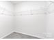 Walk-in closet featuring carpeted floor and wire rack shelving at 1117 Foxberry Ln, Maiden, NC 28650