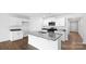 Bright kitchen featuring white cabinets, granite countertops, and stainless steel appliances at 1117 Foxberry Ln, Maiden, NC 28650