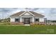 Community pool house with stone and vinyl siding and black shutters and fencing at 1117 Foxberry Ln, Maiden, NC 28650