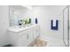 Modern bathroom with double sink, white cabinets, glass enclosed shower and marble floors create a clean aesthetic at 1129 Foxberry Ln, Maiden, NC 28650