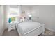 Bright bedroom with a comfortable bed, modern furniture, and ample natural light at 1129 Foxberry Ln, Maiden, NC 28650