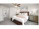 Comfortable bedroom featuring neutral decor, ceiling fan, and ample natural light for a relaxing and inviting atmosphere at 1129 Foxberry Ln, Maiden, NC 28650