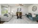 Inviting living room featuring neutral tones, comfortable seating, and a decorative ceiling fan at 1129 Foxberry Ln, Maiden, NC 28650