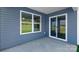 Outdoor patio featuring sliding glass doors and vinyl siding extending living space for relaxation at 1129 Foxberry Ln, Maiden, NC 28650