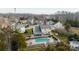 Back of home featuring a spacious backyard, a well-kept lawn, and a private fenced-in pool at 11307 Celandine Ct, Charlotte, NC 28213