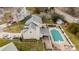 Back of home featuring a spacious backyard, a well-kept lawn, and a private fenced-in pool at 11307 Celandine Ct, Charlotte, NC 28213
