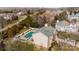 View of a backyard with an in-ground pool and a white picket fence surrounding the perimeter at 11307 Celandine Ct, Charlotte, NC 28213