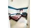 Bedroom with a modern bed frame, minimalist decor, and a bright window at 11307 Celandine Ct, Charlotte, NC 28213