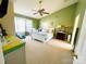 Bright bedroom with a ceiling fan, natural light, and neutral carpeting at 11307 Celandine Ct, Charlotte, NC 28213