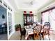 Formal dining room boasting a china cabinet, set table, and a seamless flow into other living spaces at 11307 Celandine Ct, Charlotte, NC 28213