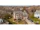 Traditional two-story brick home with dormers, two-car garage, and well-maintained landscaping at 11307 Celandine Ct, Charlotte, NC 28213