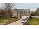 Traditional two-story brick home with dormers, two-car garage, and well-maintained landscaping at 11307 Celandine Ct, Charlotte, NC 28213