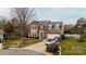 Traditional two-story brick home with dormers, two-car garage, and well-maintained landscaping at 11307 Celandine Ct, Charlotte, NC 28213