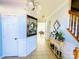 Entryway featuring tile floors, a decorative mirror, and adjacent staircase at 11307 Celandine Ct, Charlotte, NC 28213