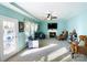 Bright living room with fireplace, tray ceiling, neutral carpet, and lots of natural light at 11307 Celandine Ct, Charlotte, NC 28213