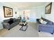 Spacious living room with two sofas, neutral decor, and plenty of natural light at 11307 Celandine Ct, Charlotte, NC 28213