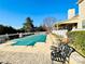 Backyard features a pool with a green cover, complemented by an outdoor seating area and well-maintained landscaping at 11307 Celandine Ct, Charlotte, NC 28213