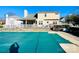 Exterior view of a home's backyard pool with a green cover, and an outdoor patio area for relaxation and entertainment at 11307 Celandine Ct, Charlotte, NC 28213