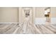 Bright hallway with light gray flooring, and white trim, leading to a bright, open living space at 119 Front Porch Dr # 46, Rock Hill, SC 29732