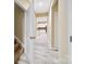 Hallway with open door leading to kitchen with modern appliances and white cabinetry at 119 Front Porch Dr # 46, Rock Hill, SC 29732