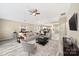 Inviting living room with a plush sofa, ceiling fan, open layout, and seamless flow into the dining area at 119 Front Porch Dr # 46, Rock Hill, SC 29732