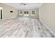 Bright living room with luxury vinyl plank flooring and sliding glass door to backyard at 119 Front Porch Dr # 46, Rock Hill, SC 29732